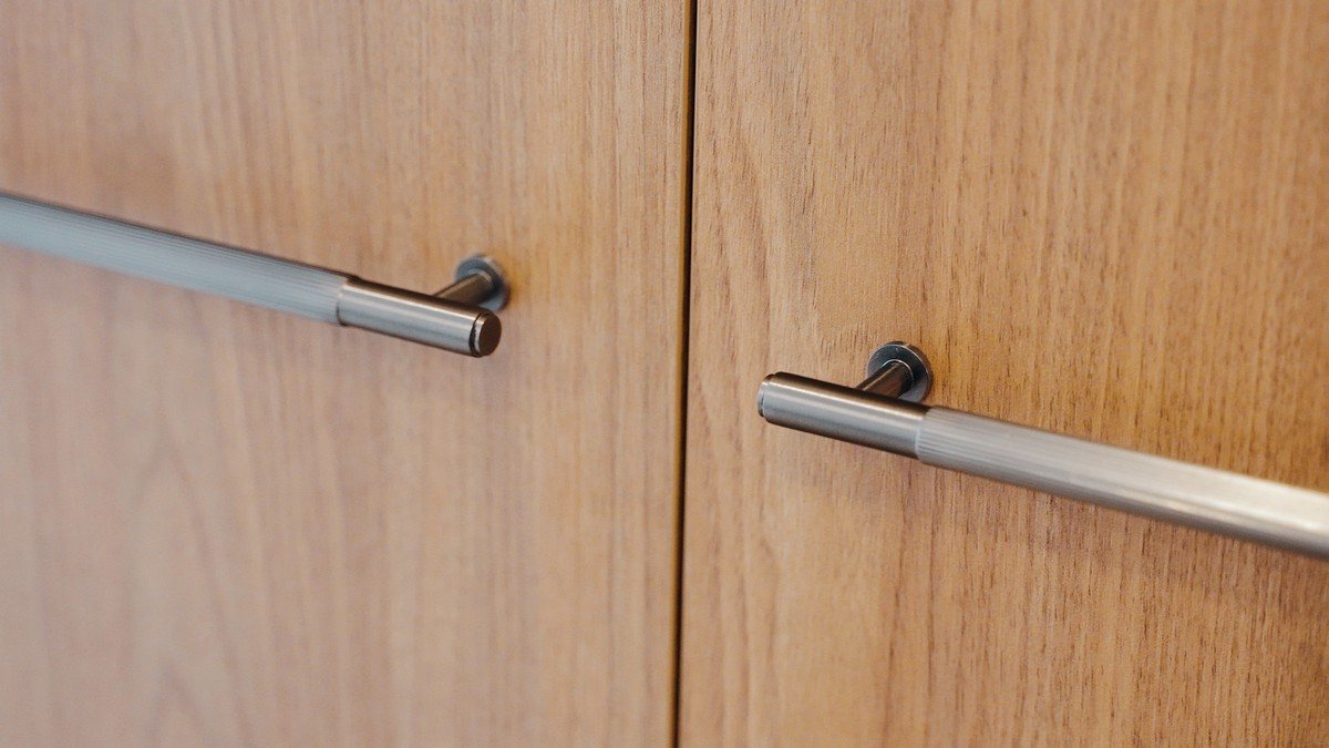 Custom timber joinery with slimline pull handles in a renovated home
